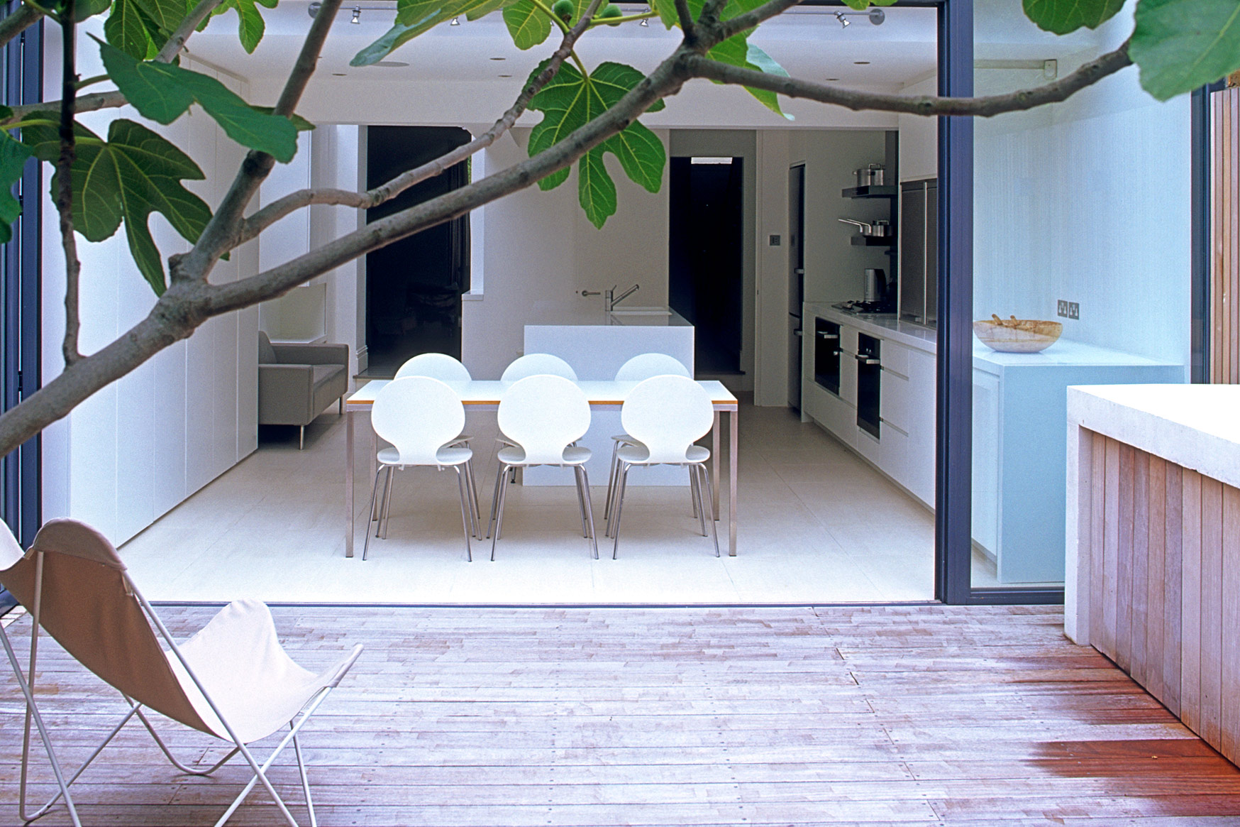 Fulham Courtyard looking back into kitchen through sliding doors - James Aldridge Landscape and Garden Design